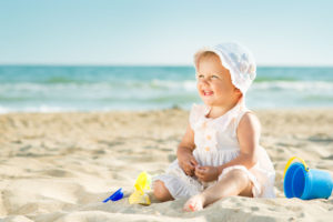 41232520 - baby playing on the sandy beach near the sea