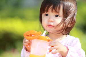 57048402 - japanese girl drinking water (1 year old)